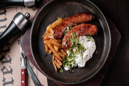 PORK AND BEEF SAUSAGE WITH FRIED POTATOES AND CHANTERELLES IN COLD SOUR CREAM
